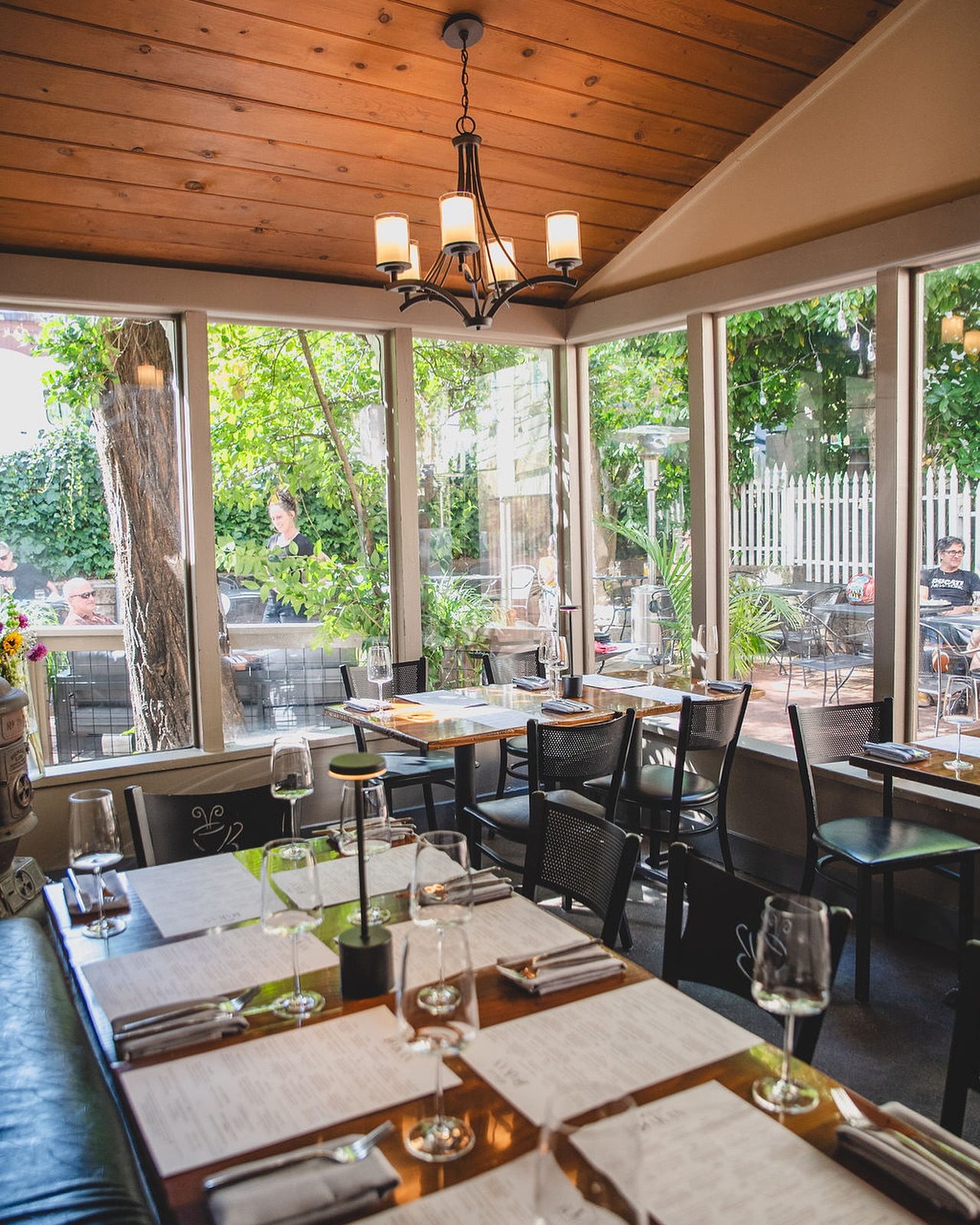 DaKan's screened dining porch overlooking the Commercial Street patio